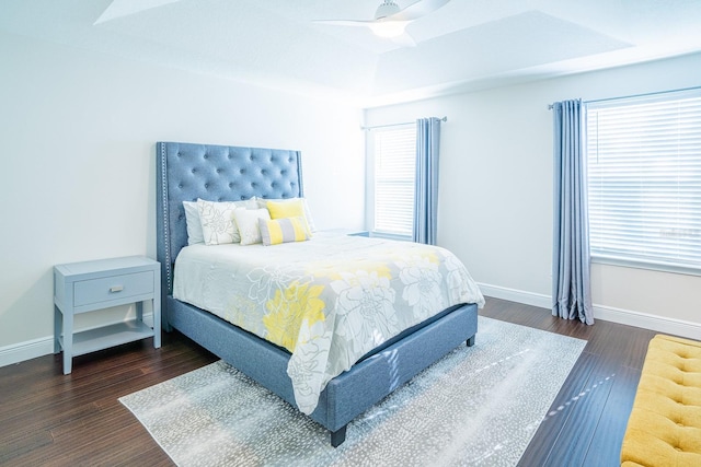 bedroom featuring ceiling fan and dark hardwood / wood-style floors