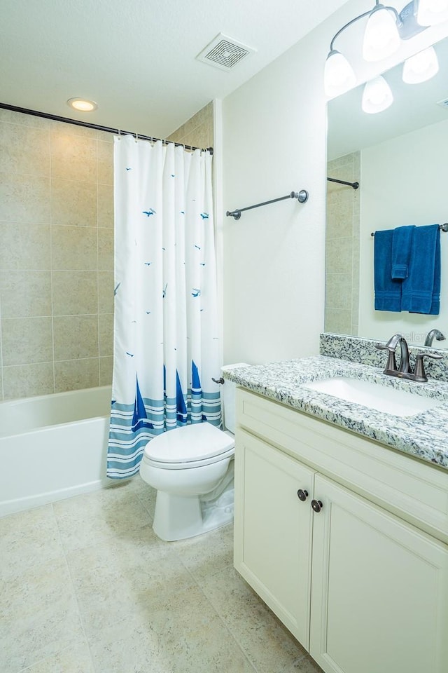 full bathroom featuring shower / bathtub combination with curtain, vanity, toilet, and tile patterned floors