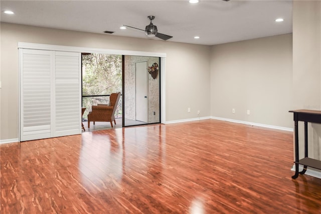 interior space with hardwood / wood-style flooring and ceiling fan