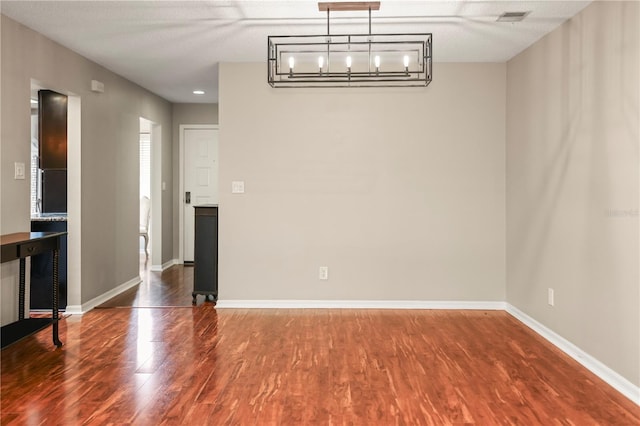 unfurnished dining area with hardwood / wood-style flooring