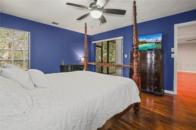 bedroom featuring ceiling fan and dark hardwood / wood-style flooring