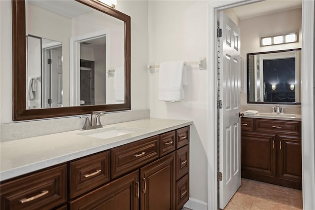 bathroom with vanity and tile patterned flooring