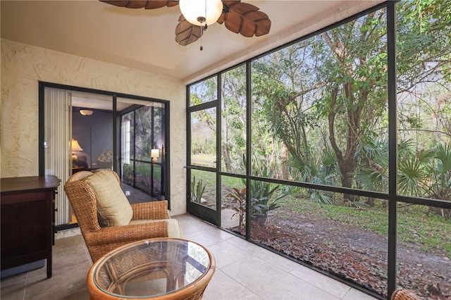 sunroom / solarium with ceiling fan