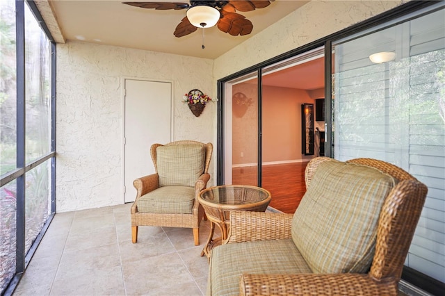 sunroom with ceiling fan and a wealth of natural light