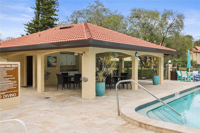 view of swimming pool featuring a gazebo and a patio area