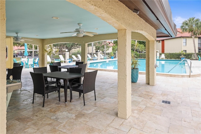 view of pool featuring ceiling fan and a patio