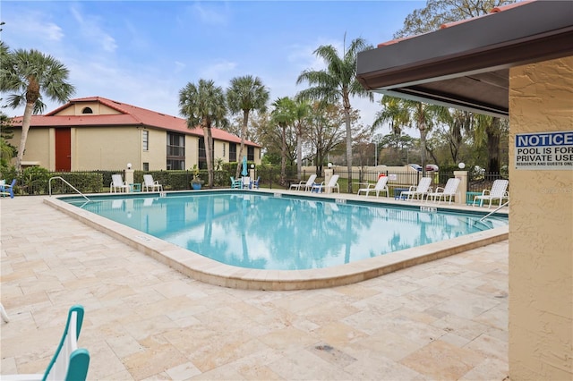 view of swimming pool with a patio area