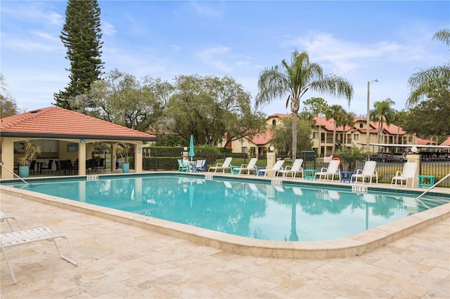 view of swimming pool featuring a patio