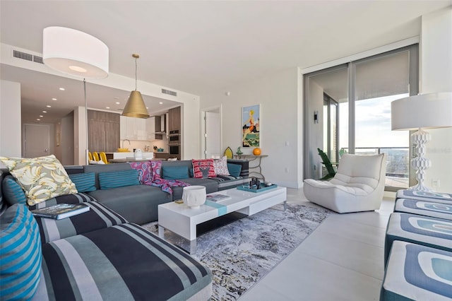 living room with floor to ceiling windows