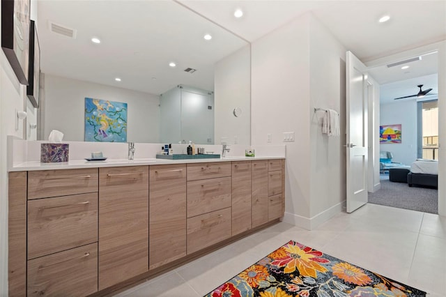 bathroom featuring vanity, tile patterned flooring, and ceiling fan