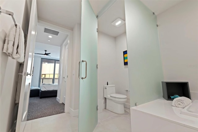 bathroom with tile patterned flooring and toilet