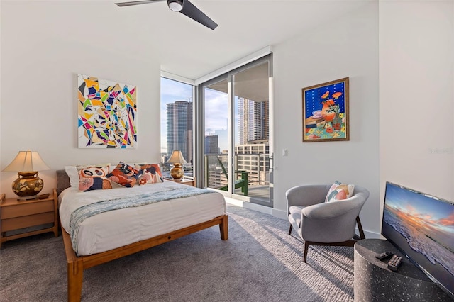 bedroom with ceiling fan, carpet flooring, access to outside, and a wall of windows