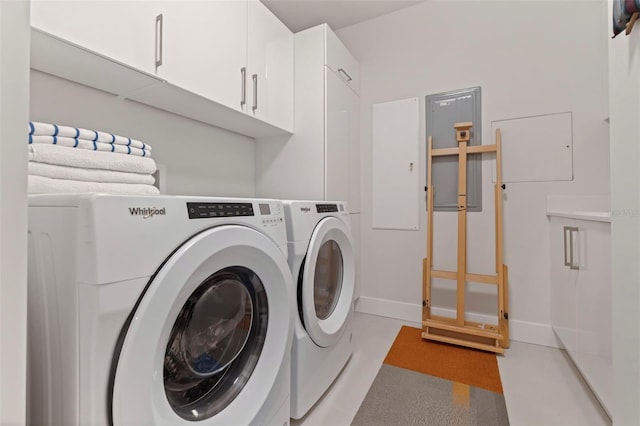 washroom featuring cabinets and washer and dryer