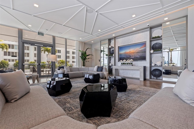 living room with expansive windows and french doors