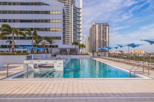 view of swimming pool featuring a patio