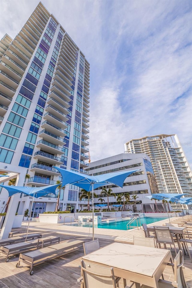 view of building exterior with a community pool