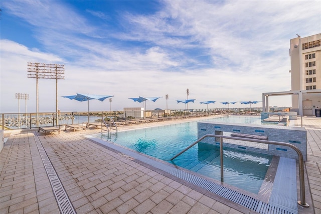 view of pool featuring a patio area