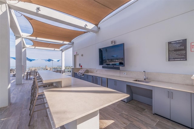 view of patio / terrace featuring sink and an outdoor kitchen