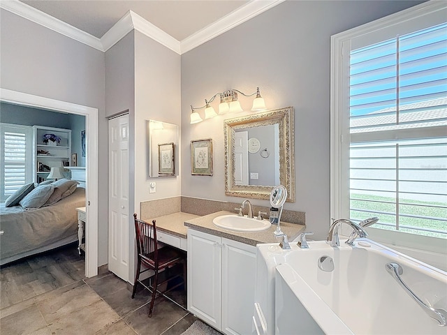 bathroom with vanity, ornamental molding, a bath, and a healthy amount of sunlight