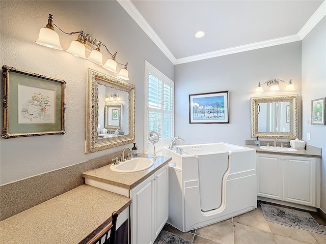 bathroom with tile patterned floors, ornamental molding, a bath, and vanity