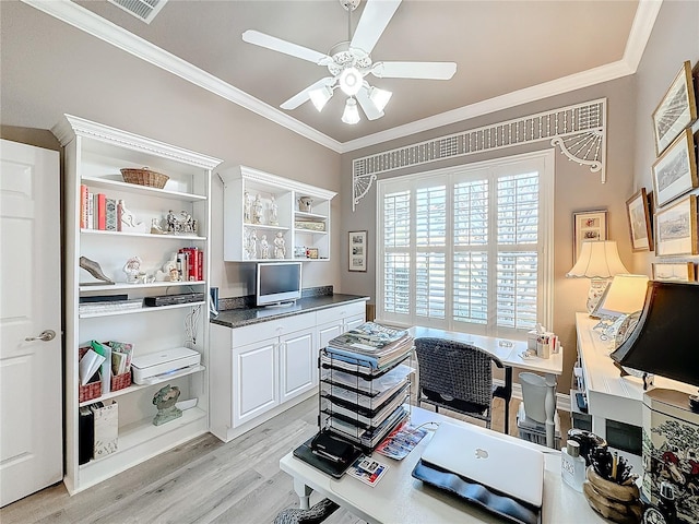 home office featuring crown molding, ceiling fan, and light hardwood / wood-style flooring