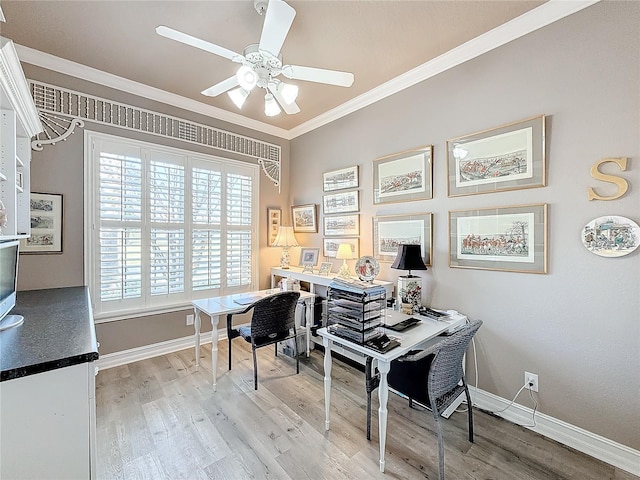 home office with crown molding, ceiling fan, and hardwood / wood-style flooring