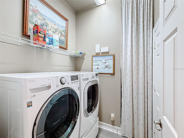 washroom featuring separate washer and dryer