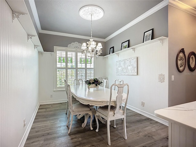 dining space featuring baseboards, ornamental molding, dark wood-style flooring, and a notable chandelier