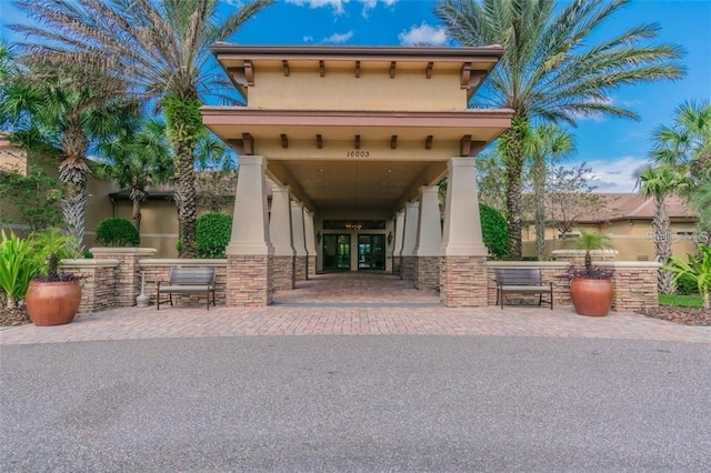 property entrance with stucco siding