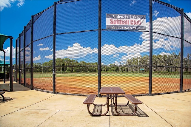 view of home's community featuring fence