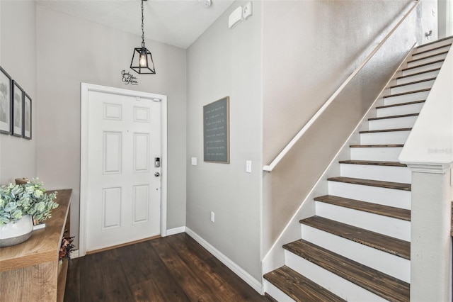 foyer with dark wood-type flooring