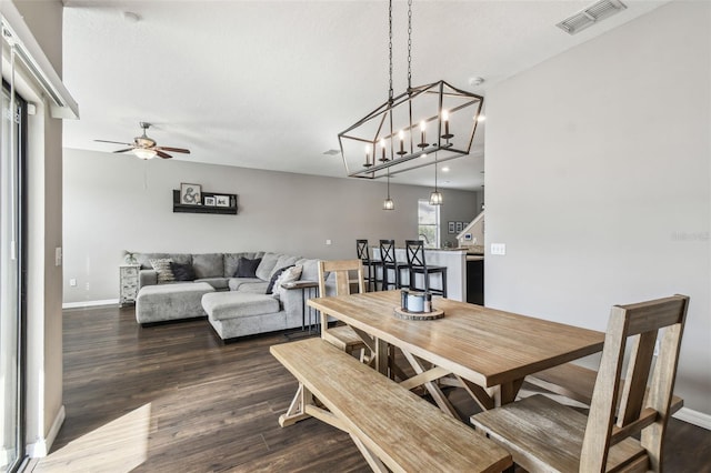 dining space featuring dark hardwood / wood-style flooring and ceiling fan