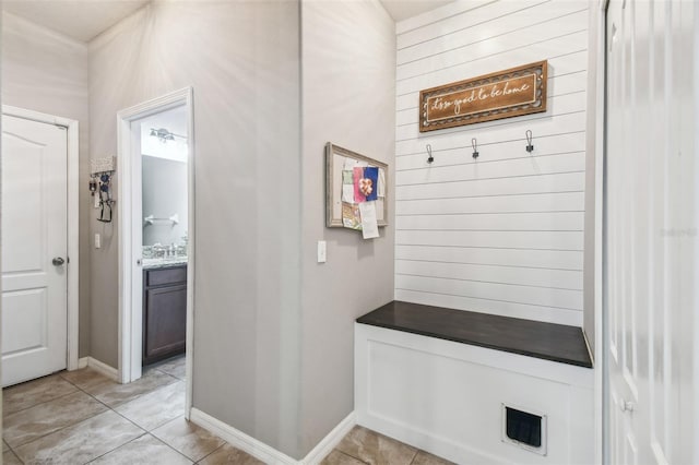 mudroom with light tile patterned floors