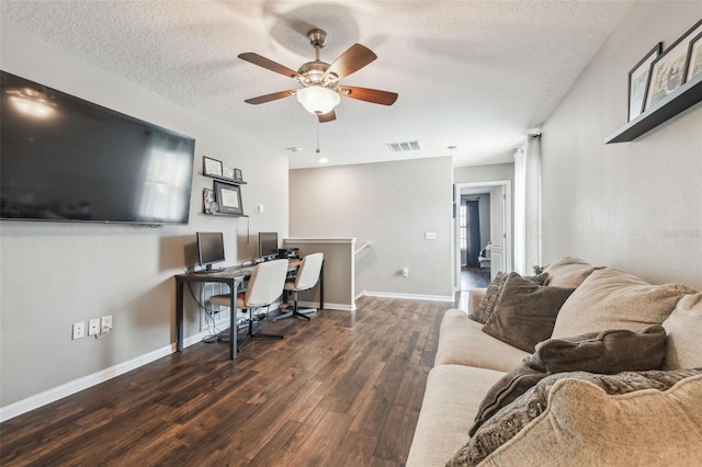 office with ceiling fan, a textured ceiling, and dark hardwood / wood-style flooring