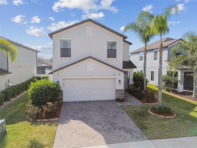 view of front of property with a garage and a front yard