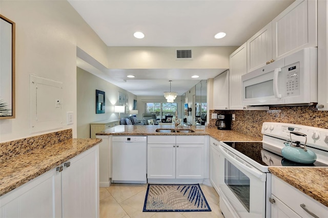 kitchen featuring white cabinetry, white appliances, sink, and tasteful backsplash