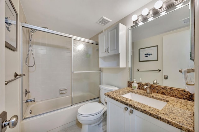 full bathroom with vanity, enclosed tub / shower combo, and toilet