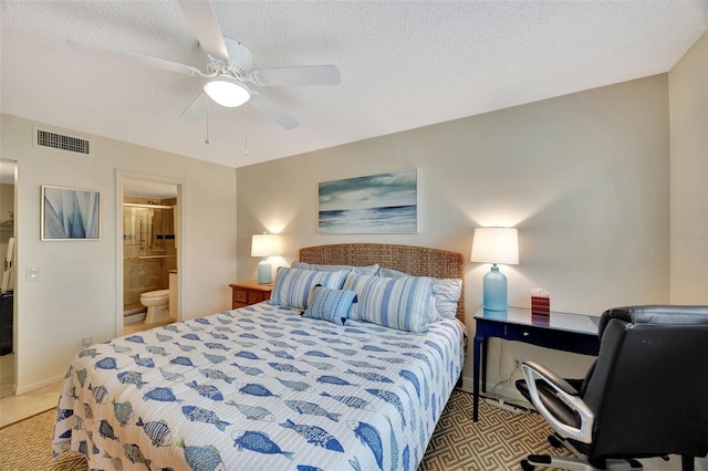 tiled bedroom with ceiling fan, connected bathroom, and a textured ceiling