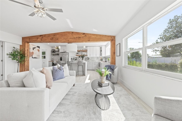 living room with lofted ceiling and ceiling fan