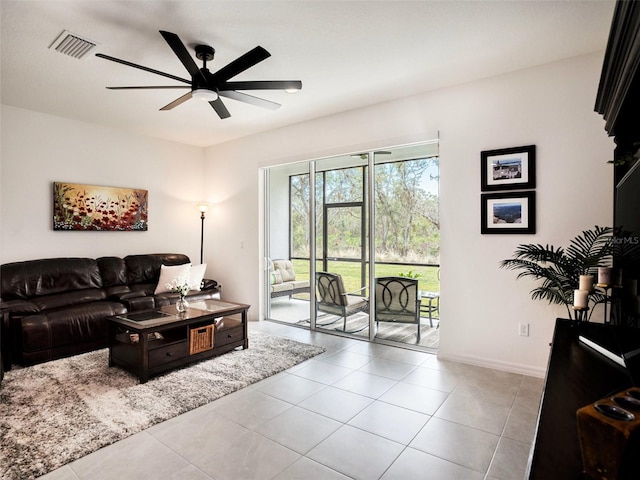 tiled living room featuring ceiling fan