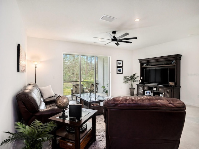 living room with a ceiling fan, recessed lighting, visible vents, and baseboards