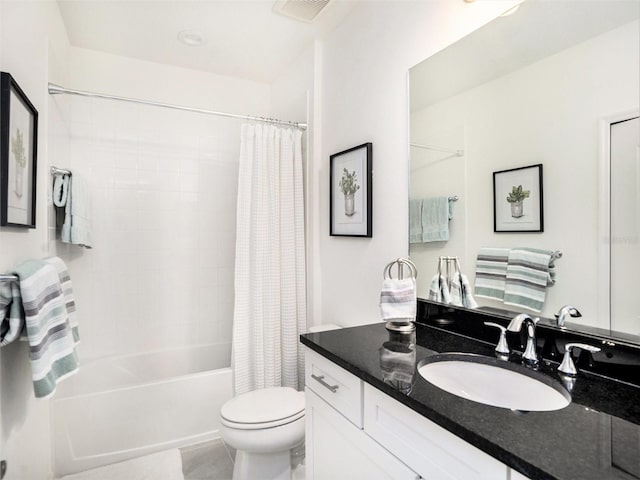 bathroom with visible vents, shower / tub combo with curtain, vanity, and toilet