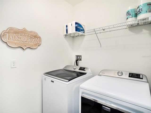 laundry area featuring laundry area and washing machine and clothes dryer