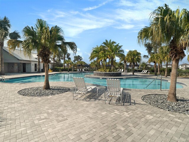 community pool with a patio