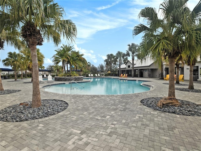 community pool featuring a patio area