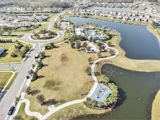 bird's eye view with a water view and a residential view