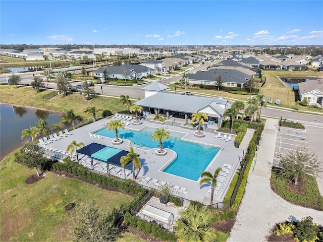 aerial view featuring a water view and a residential view