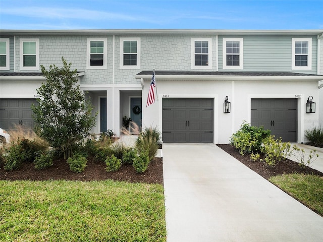 view of front of home with a garage and driveway