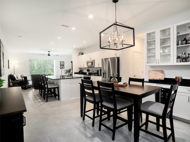 dining space with ceiling fan, visible vents, and recessed lighting