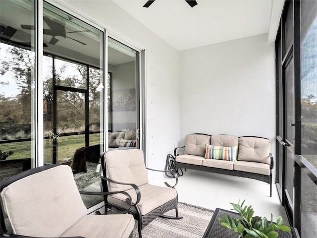 sunroom with a ceiling fan